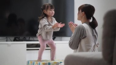 Parents and children playing on an indoor trampoline