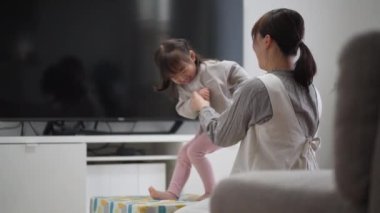 Parents and children playing on an indoor trampoline