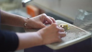 Image of a woman polishing glass