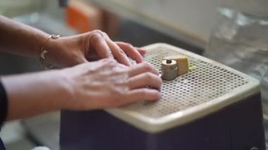 Image of a woman polishing glass