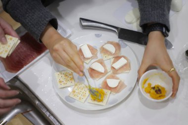 Image of a woman preparing a meal