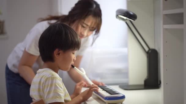 Parent Child Practicing Keyboard Harmonica — Stock Video