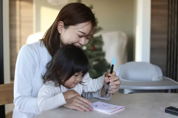 Parent Child Writing New Year Cards — Stock Photo, Image