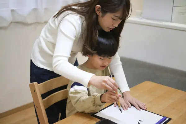 Parent Child Doing Calligraphy — Stock Photo, Image