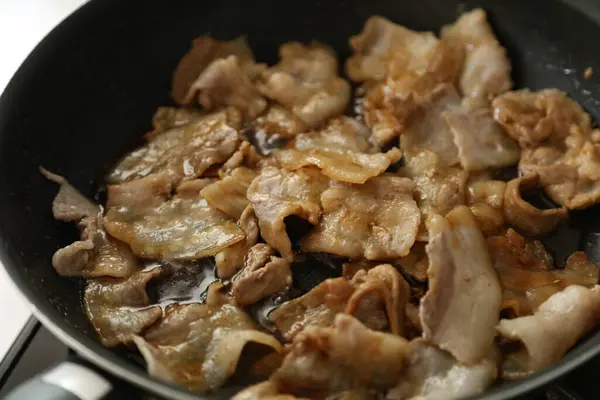 stock image Coating the pork with sauce