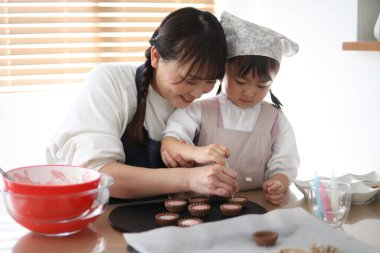 Parents and children making sweets