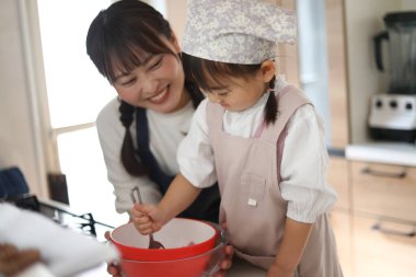 Parents and children making sweets
