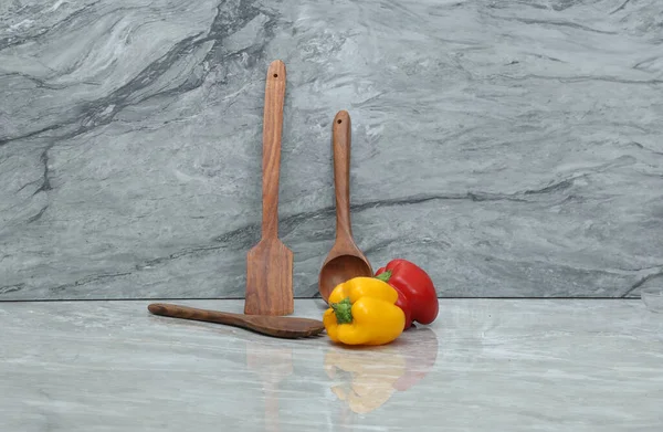 Red Yellow Vegies Wooden Spoons Grey Marble Background — Stock Photo, Image