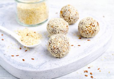 Coconut Vegan Sweets, Delicious Candy Balls, Healthy Candies on grey bright background