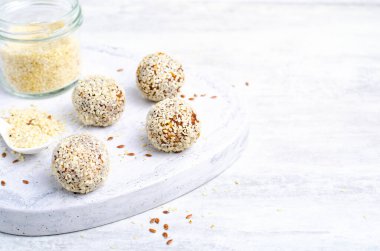 Coconut Vegan Sweets, Delicious Candy Balls, Healthy Candies on grey bright background