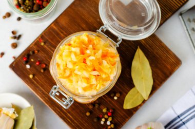 Sauerkraut, Shredded cabbage, apples, and carrots on bright rustic background, Healthy Eating, Fermented Food