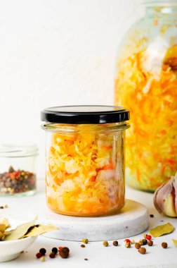 Sauerkraut, Shredded cabbage, apples, and carrots on bright rustic background, Healthy Eating, Fermented Food