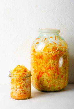 Sauerkraut, Shredded cabbage, apples, and carrots on bright rustic background, Healthy Eating, Fermented Food