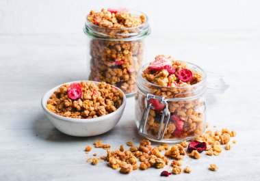 Granola with Dried Berries on Bright Background, Healthy Breakfast