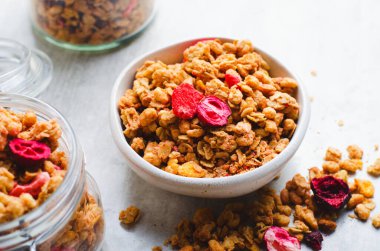 Granola with Dried Berries on Bright Background, Healthy Breakfast