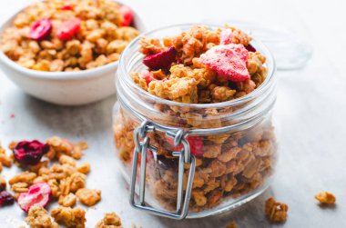 Granola with Dried Berries on Bright Background, Healthy Breakfast