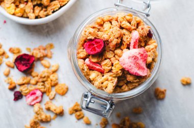 Granola with Dried Berries on Bright Background, Healthy Breakfast