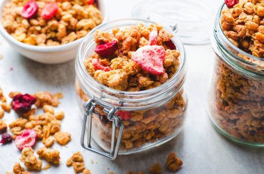 Granola with Dried Berries on Bright Background, Healthy Breakfast