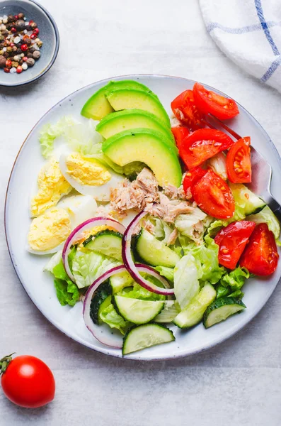 Tuna Salad, Healthy Food, Fresh Salad with Lettuce, Avocado, Cherries, Cucumber and Eggs on a Plate