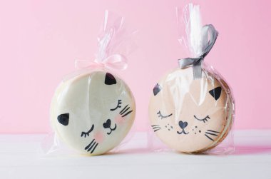 Adorable Cat Macaron Cookies, Delicious French Dessert on Bright Background