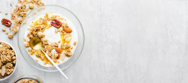 stock image Granola with Nut Mix and Yogurt in a Boal, Healthy Breakfast, Muesli with Dried Berries on Bright Background