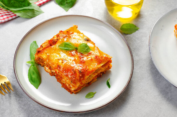 Delicious Homemade Lasagna with Bolognese Sauce on Bright Background, Italian Cuisine, Traditional Baked Lasagna