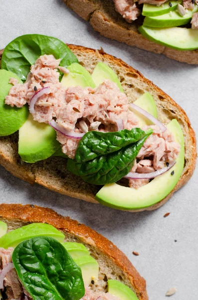 stock image Tuna Avocado Toasts, Healthy Snack or Breakfast on Bright Concrete Background