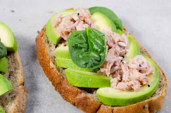 stock image Tuna Avocado Toasts, Healthy Snack or Breakfast on Bright Concrete Background