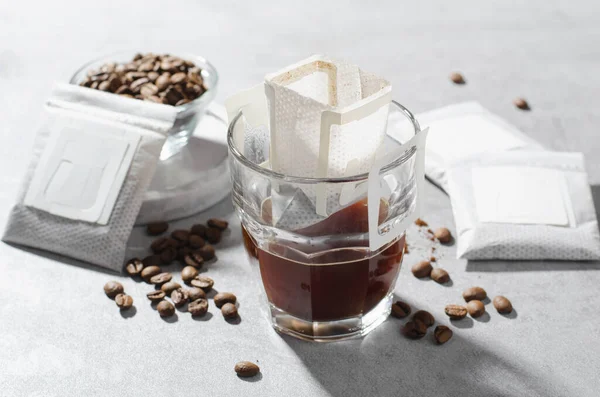 stock image Drip Coffee Bag in a Cup, Coffee Trend, Quick Way to Brew Ground Coffee Using Paper Type Filter