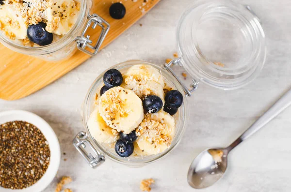 stock image Overnight Oats, Oatmeal with Banana, Fresh Blueberry and Chia, Healthy Breakfast or Snack