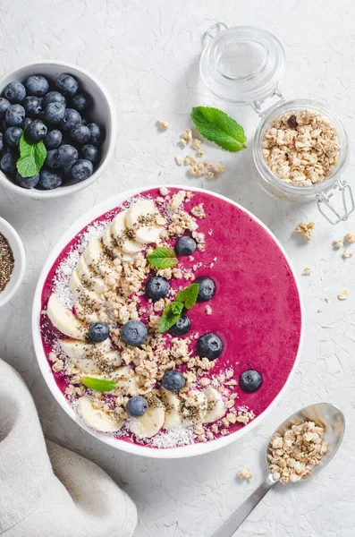 stock image Blueberry Smoothie Bowl with Granola, Banana, and Chia Seeds, Healthy Food, Vegan or Vegetarian Diet Food Concept, Bright Background