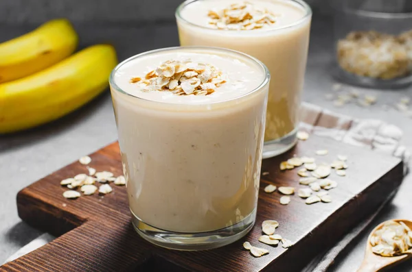 stock image Banana Smoothie with Oats, Healthy Food, Vegan or Vegetarian Diet Food Concept, Grey Concrete Background