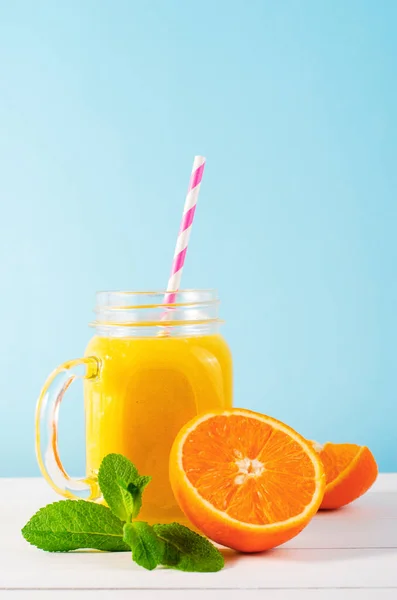 stock image Orange Smoothie in a Jar, Vitamin Drink or Refreshing Cocktail on Bright Background