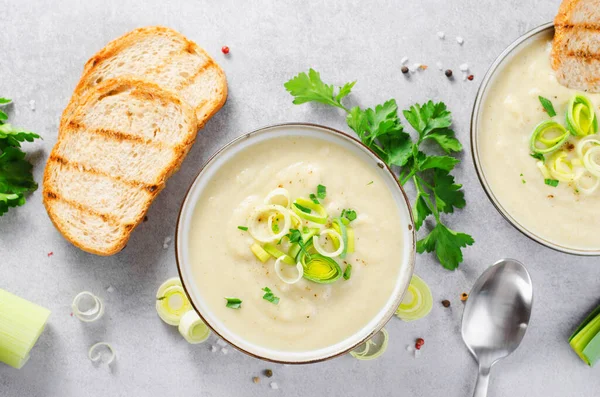 Leek Soup, Comfort Meal, Potato and Leek Creamy Soup, Vegetarian Food on Bright Grey Background