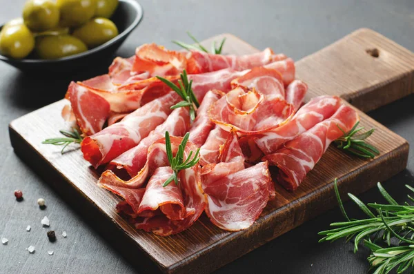 stock image Cured Meat Platter, Antipasto, Appetizer on a Boardover Dark Background