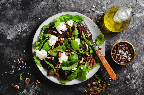 Stock image Fresh Salad with Beetroot, Feta Cheese, and Pecans, Vegetarian Meal on Dark Background