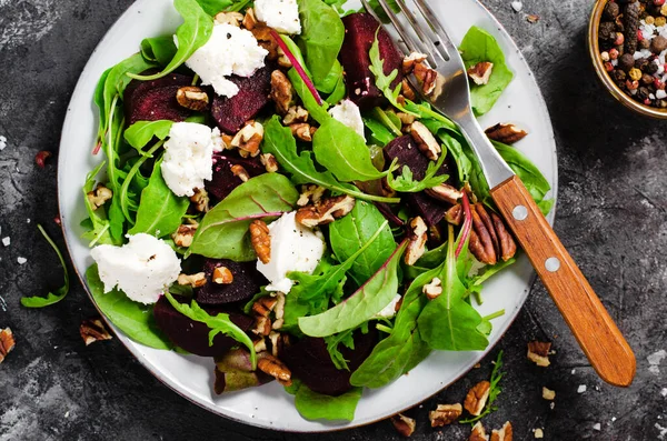 stock image Fresh Salad with Beetroot, Feta Cheese, and Pecans, Vegetarian Meal on Dark Background