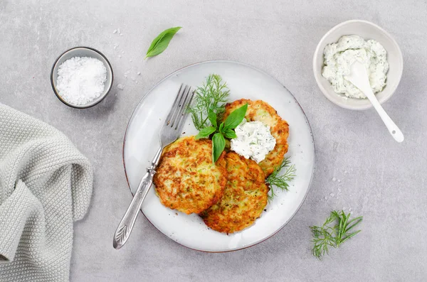 stock image Zucchini Fritters with Herbs and Cream Cheese Topping, Tasty Vegetable Pancakes, Vegetarian Meal