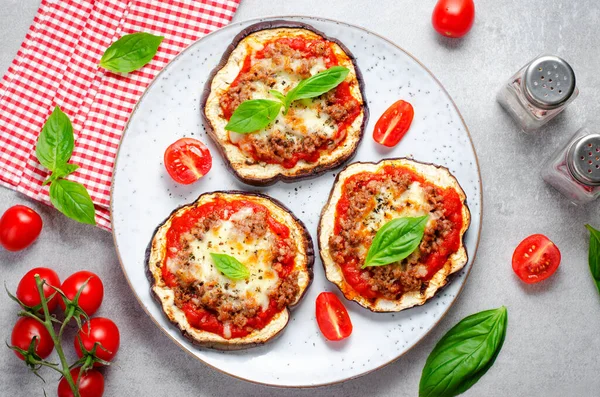 stock image Eggplant Pizza with Tomato Sauce, Minced Meat, Mozzarella and Basil, Mini Pizza over Bright Background