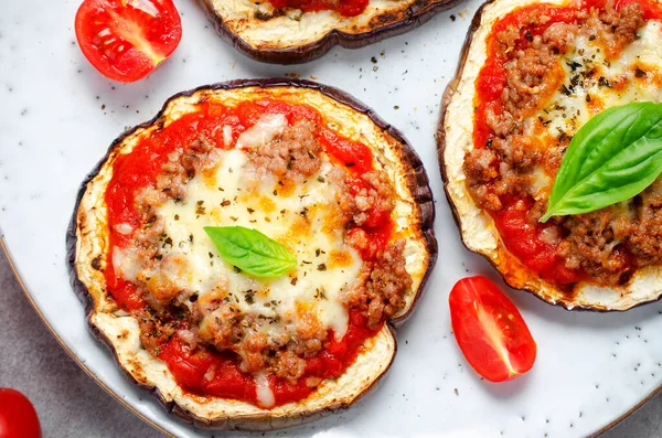 stock image Eggplant Pizza with Tomato Sauce, Minced Meat, Mozzarella and Basil, Mini Pizza over Bright Background