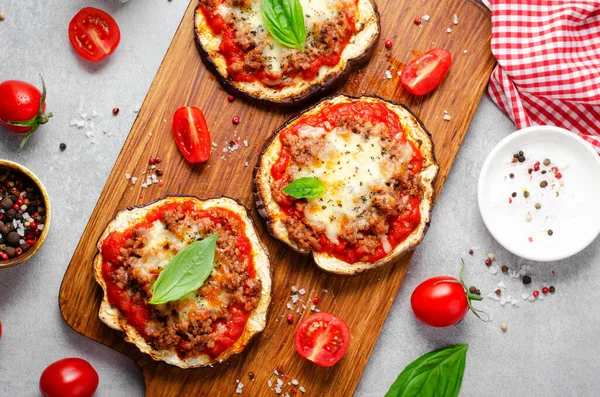 Stock image Eggplant Pizza with Tomato Sauce, Minced Meat, Mozzarella and Basil, Mini Pizza over Bright Background