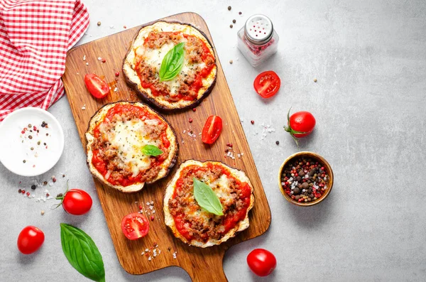 stock image Eggplant Pizza with Tomato Sauce, Minced Meat, Mozzarella and Basil, Mini Pizza over Bright Background