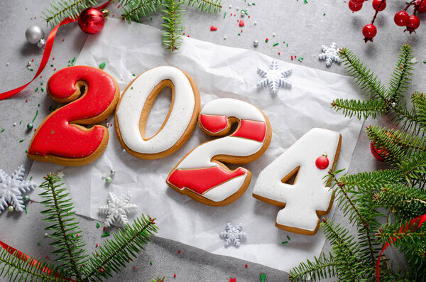 New Year 2024 Gingerbread Cookies on Bright Festive Background, Handmade Christmas Treat