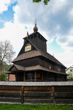 Wooden church in a village in western Ukraine clipart