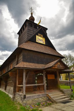 Wooden church in a village in western Ukraine clipart