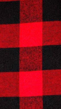 Arkaplan için kırmızı ve siyah kareli kumaş.