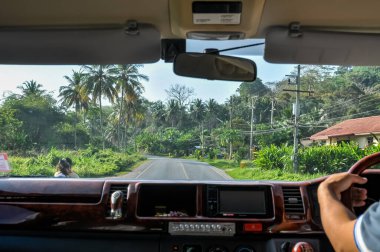 Luxury minivan interior with driver: customized cabin, road trip, internal view, comfort.