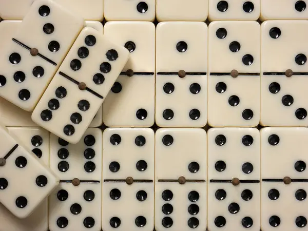 Dominoes is a classic tabletop game . It is a game that combines skill, strategy, and sometimes chance. Here\'s a detailed description of dominoes