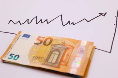 Representation of the economy in banknotes of different denominations in euros with a white background
