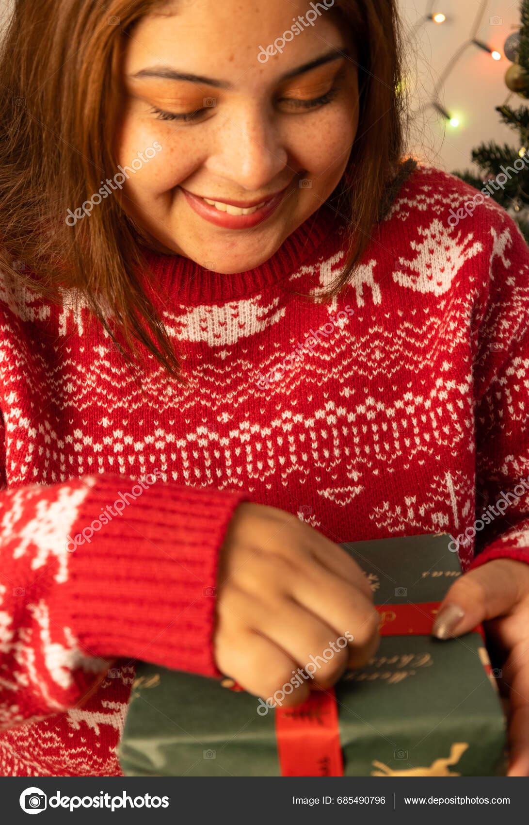 Cheerful Young Woman Opening Christmas Gift Christmas Eve Wearing cheerful-young-woman-opening-christmas-gift-christmas-eve-wearing